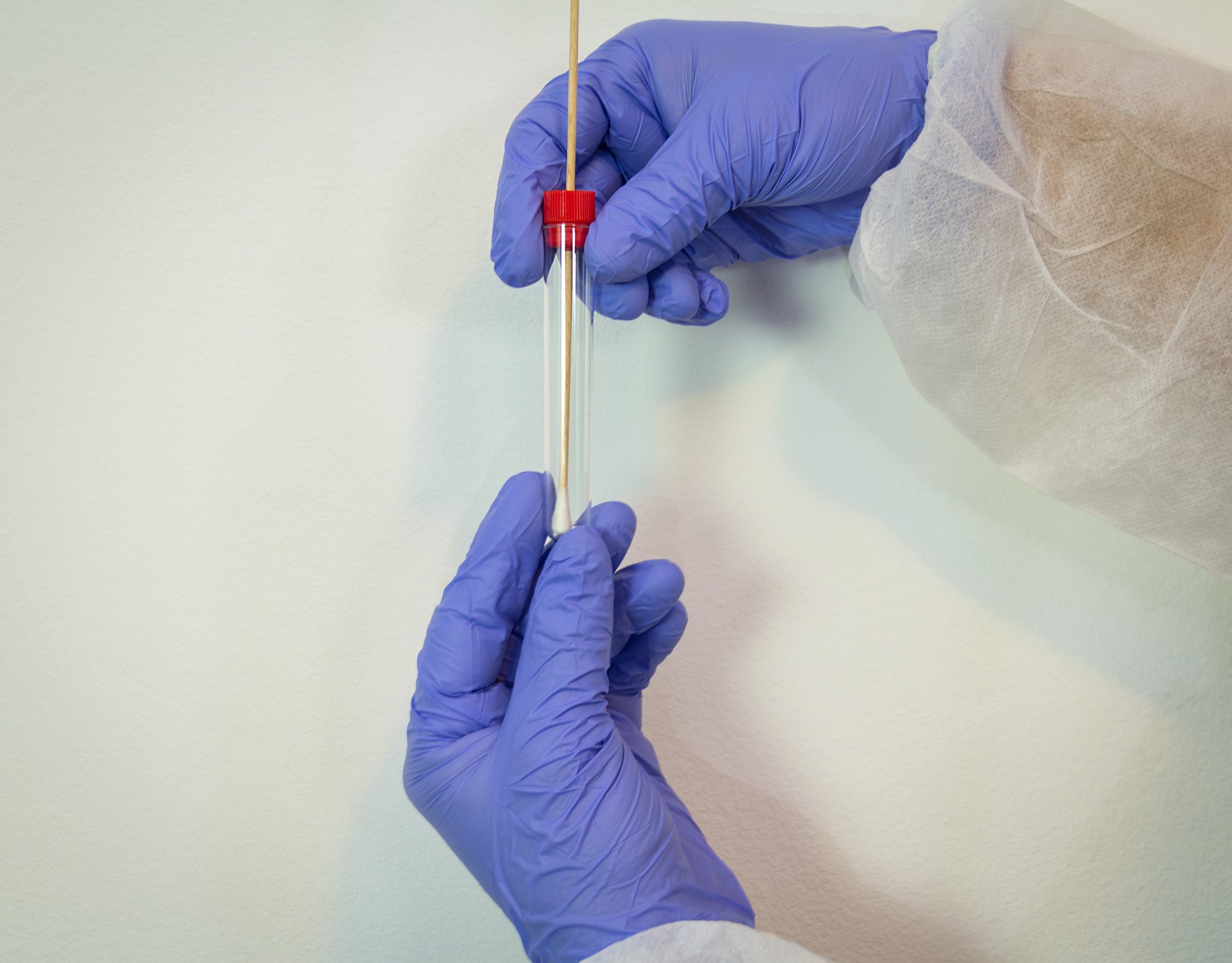 Specimen collector technician collecting DNA swab samples